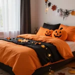 Decorated bedroom with Halloween themed bedding, pumpkins, string lights, and autumn foliage for seasonal bedroom makeover