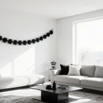 Minimalist black and white Halloween decorations featuring simple geometric shapes, monochrome pumpkins, and elegant spooky a